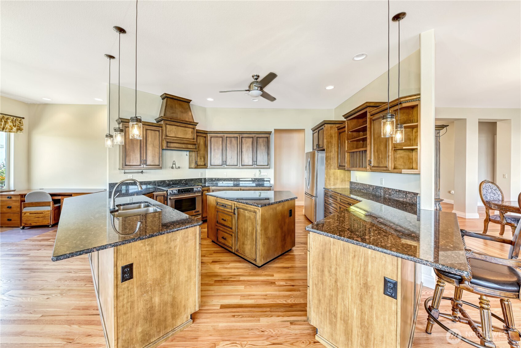 254 Caseco Lane Port Orchard, WA 98366 - Photo 14 of 28 a kitchen with stainless steel appliances granite countertop a sink and a stove with granite countertops