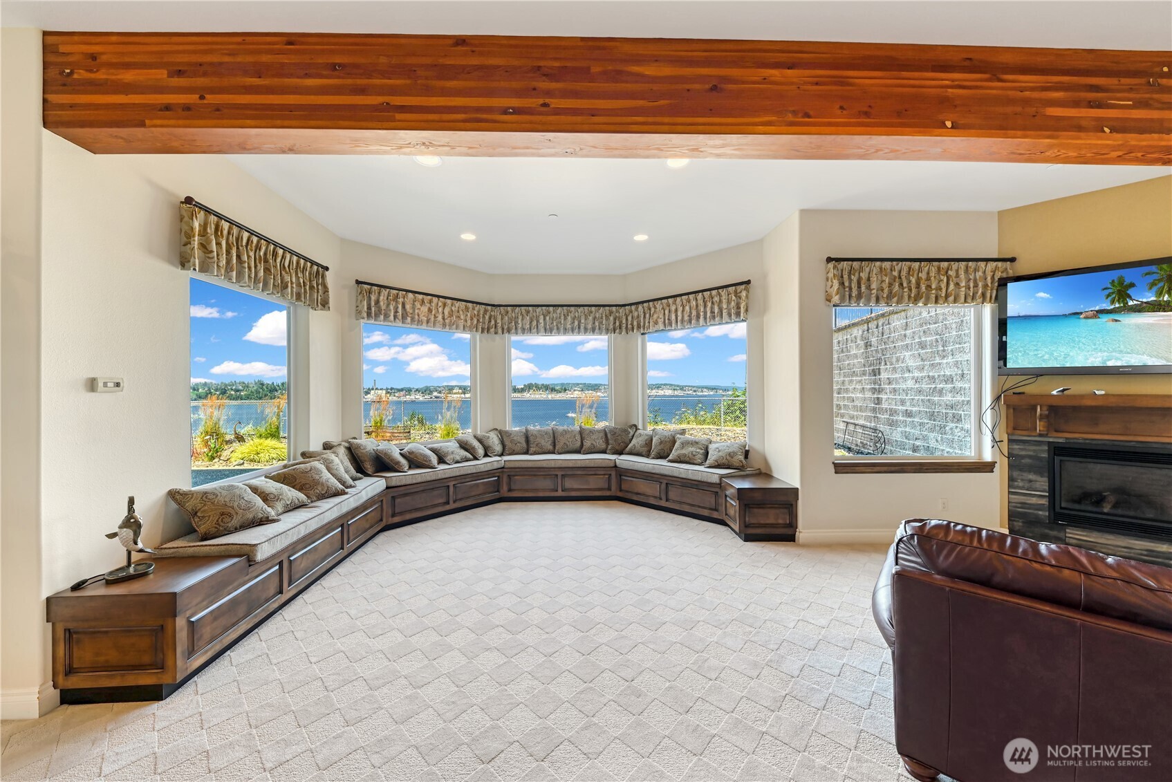 254 Caseco Lane Port Orchard, WA 98366 - Photo 24 of 28 a living room with furniture fireplace and a flat screen tv