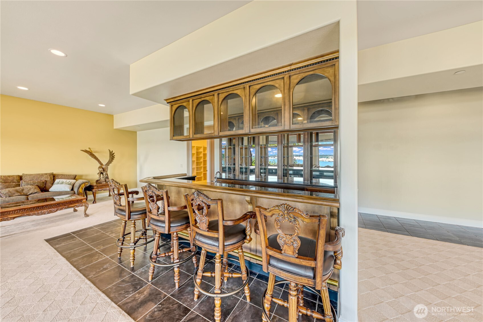 254 Caseco Lane Port Orchard, WA 98366 - Photo 25 of 28 a view of a dining room with furniture and a floor to ceiling window