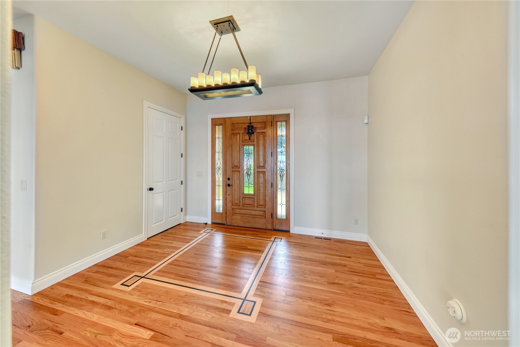 254 Caseco Lane Port Orchard, WA 98366 - Photo 7 of 28 a view of a room with wooden floor and chandelier