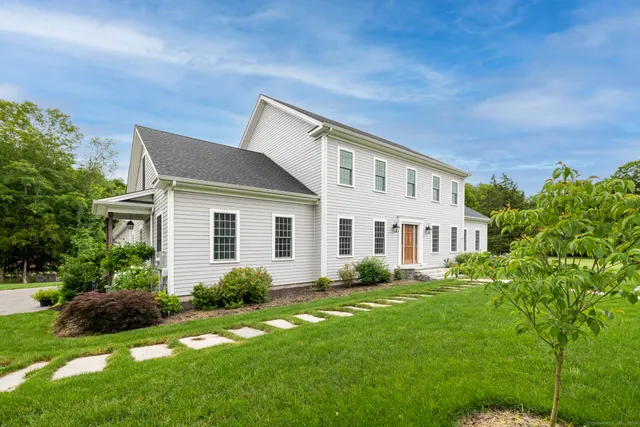 a front view of a house with a yard