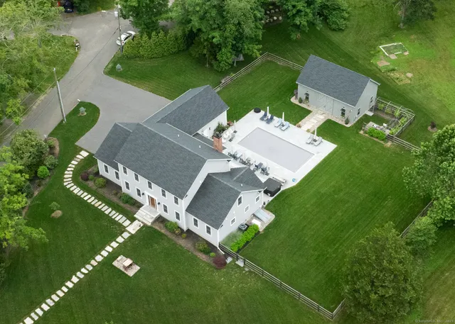 an aerial view of a house with a garden