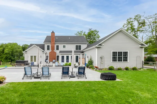 a front view of house with a garden and patio