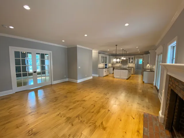 a view of an empty room with a fireplace