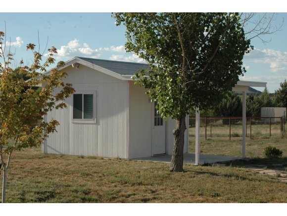 3520 North Reed Road Chino Valley, AZ 86323 - Photo 6 of 7 a backyard of a house with lots of green space