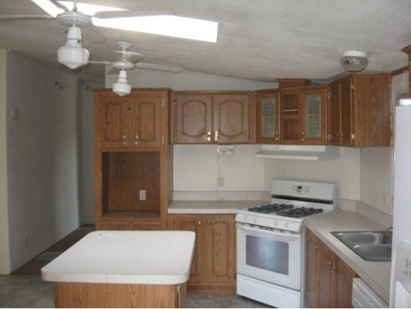 3520 North Reed Road Chino Valley, AZ 86323 - Photo 7 of 7 a kitchen with a sink a stove and cabinets