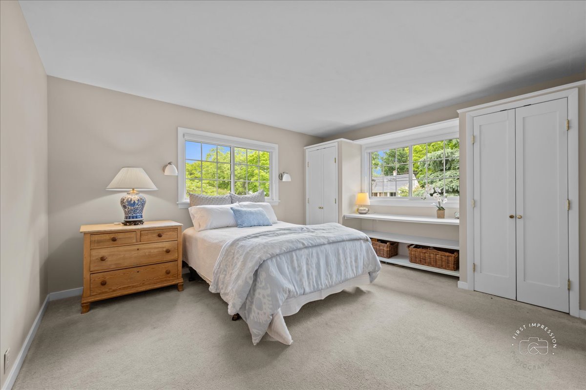 705 Meadows Road Geneva, IL 60134 - Photo 11 of 27 a bedroom with a bed and a window