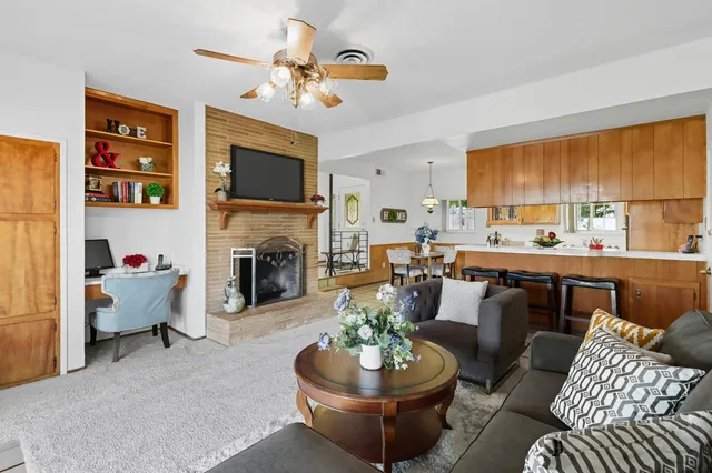 a kitchen with stainless steel appliances a stove a sink and a refrigerator