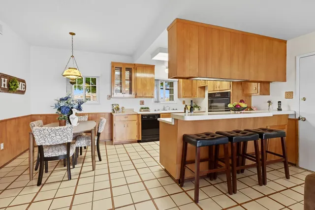 a kitchen with a sink cabinets and window