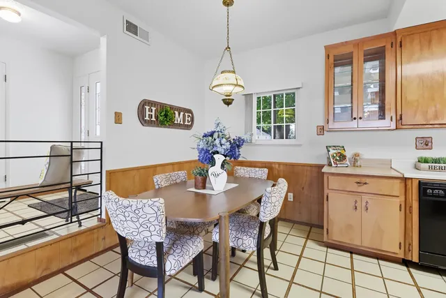 a bedroom with a bed and a lamp