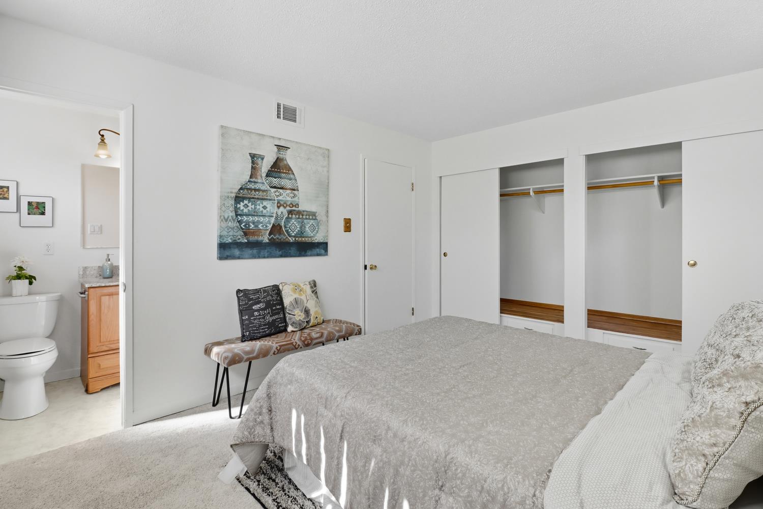 3366 Point Pleasant Road Elk Grove, CA 95757 - Photo 29 of 60 a bedroom with a large bed and a chandelier