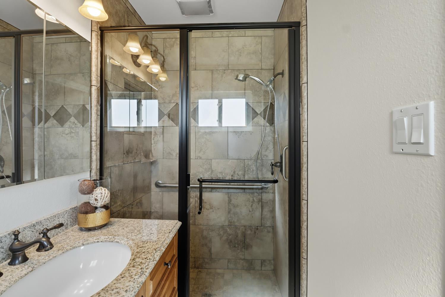3366 Point Pleasant Road Elk Grove, CA 95757 - Photo 31 of 60 a bathroom with a granite countertop sink toilet and shower
