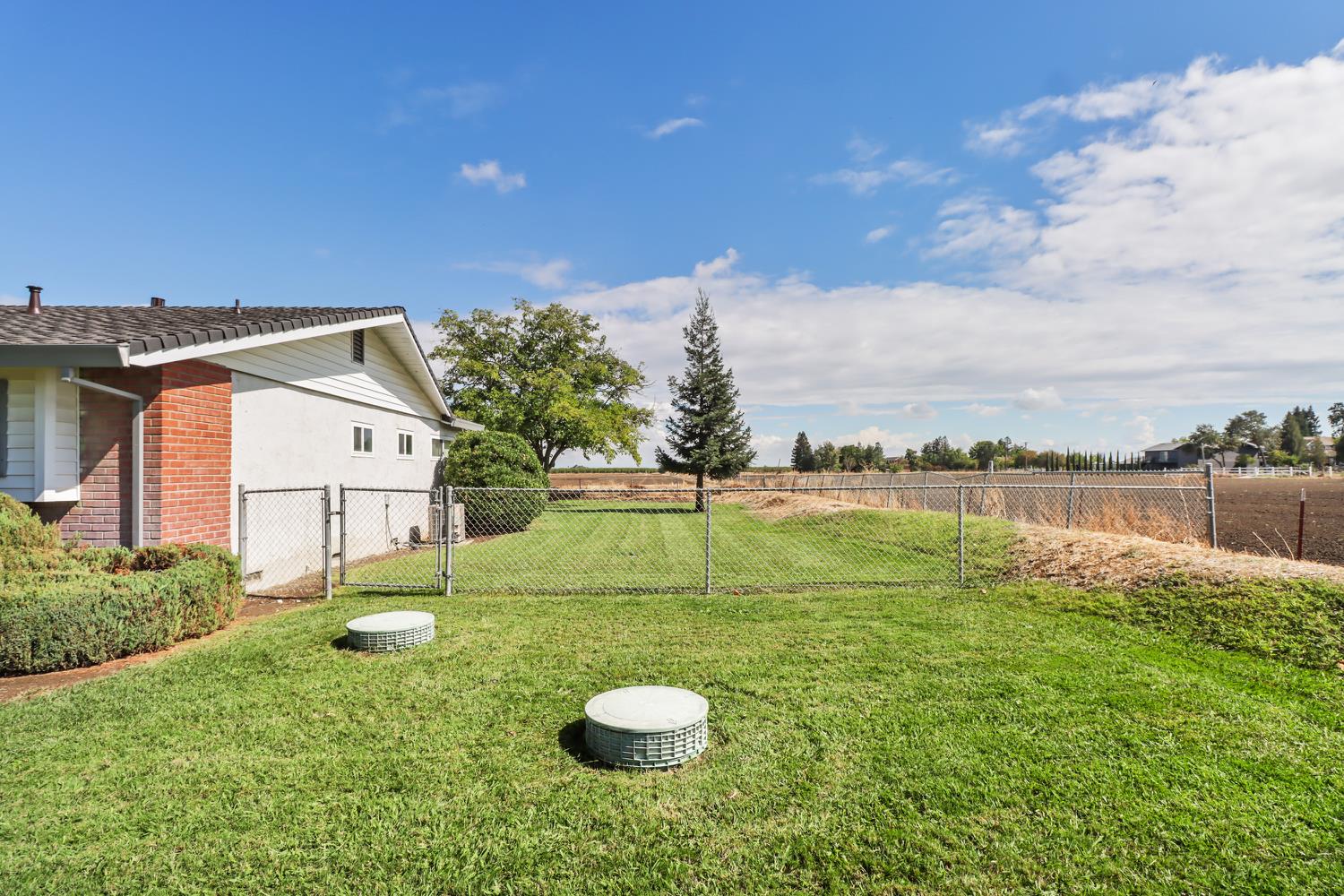 3366 Point Pleasant Road Elk Grove, CA 95757 - Photo 39 of 60 a view of a house with a yard