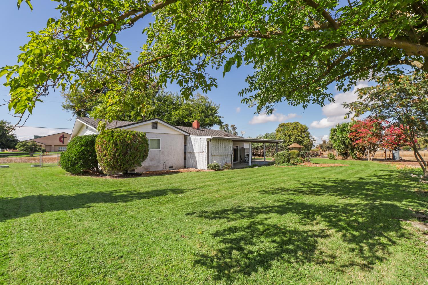 3366 Point Pleasant Road Elk Grove, CA 95757 - Photo 43 of 60 a view of a big yard with plants and large trees