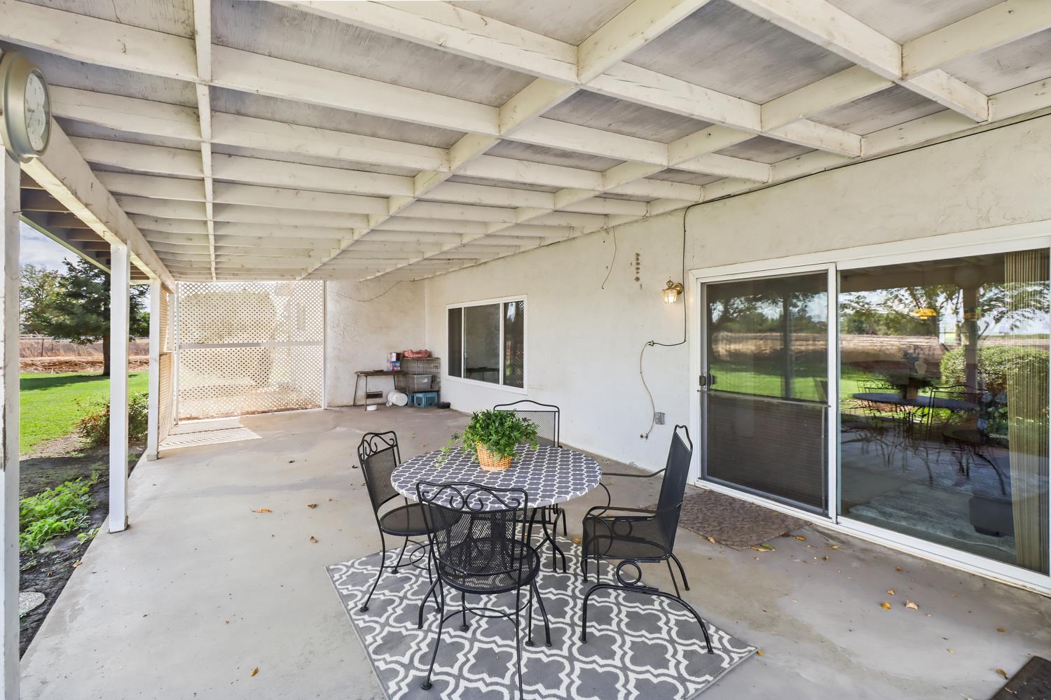 3366 Point Pleasant Road Elk Grove, CA 95757 - Photo 47 of 60 a view of a patio with table and chairs and potted plants