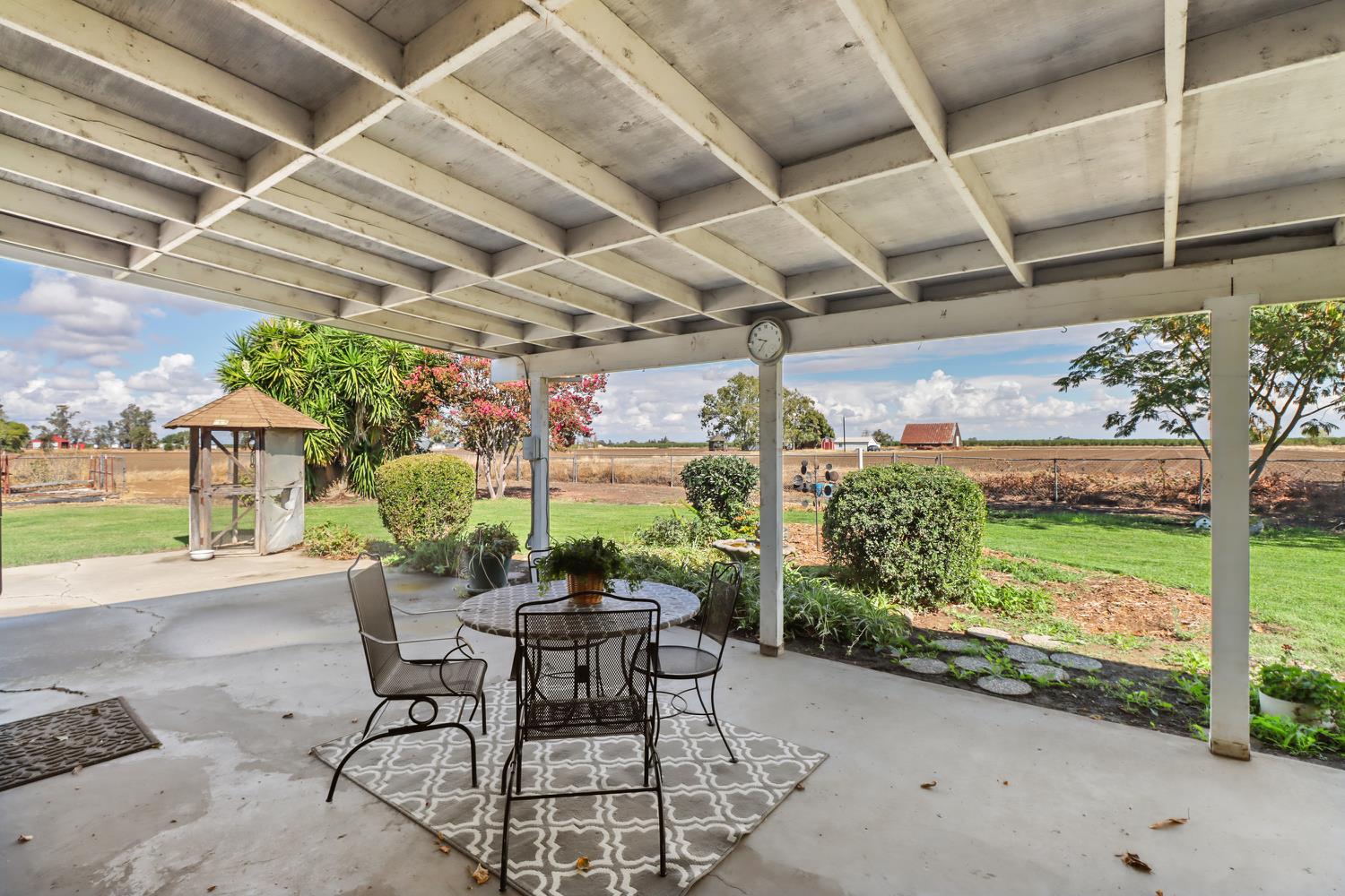 3366 Point Pleasant Road Elk Grove, CA 95757 - Photo 49 of 60 a patio with table and chairs and potted plants