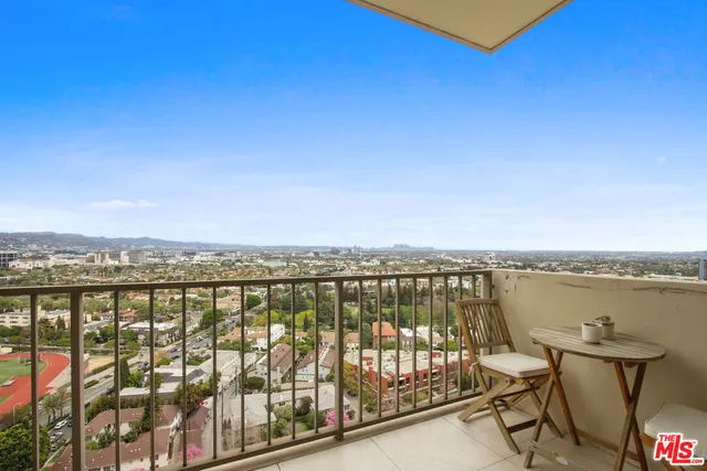 a view of a balcony with an ocean view