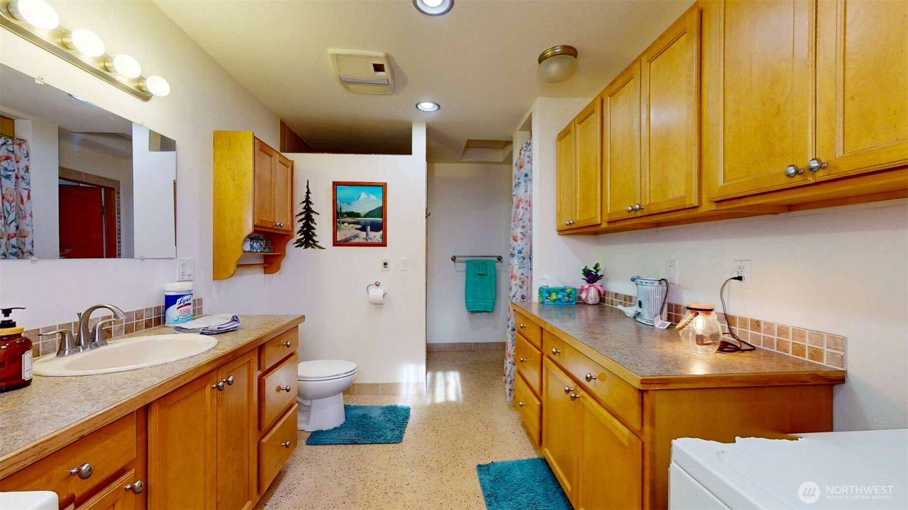 46 Shumway Road Omak, WA 98841 - Photo 18 of 40 a bathroom with a sink a toilet and a mirror