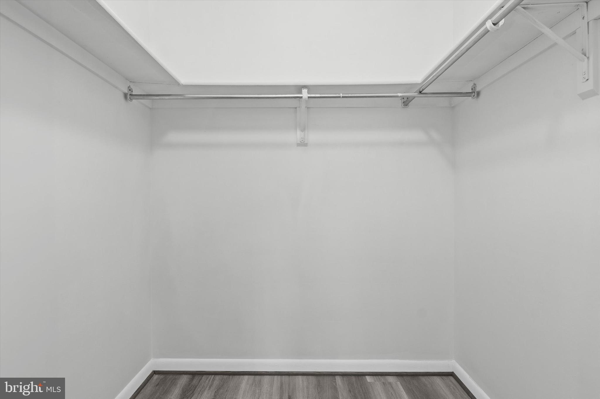 10350 Luria Commons Court, Unit 3H Burke, VA 22015 - Photo 18 of 22 a view of a room with racks on the wall