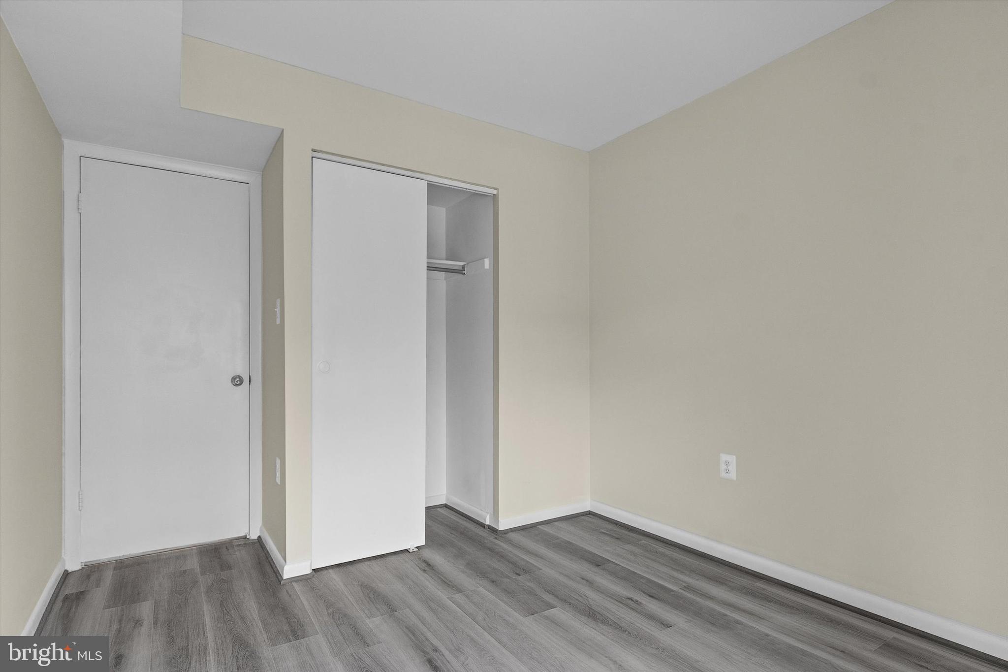 10350 Luria Commons Court, Unit 3H Burke, VA 22015 - Photo 19 of 22 a view of an empty room with wooden floor