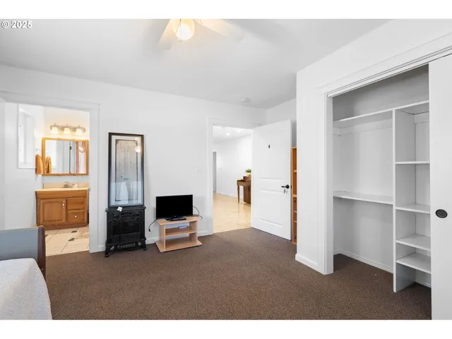a living room with furniture and flat screen tv