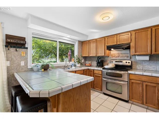 a kitchen with a sink stove and microwave