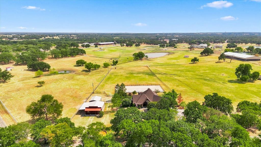 9229 Hub Clark Road Pilot Point, TX 76258 - Photo 35 of 35 View from front with Home, Workshop, 2 Stall Barn, Professional Riding Arena. Property extends in rectangular to rear fence behind arena.