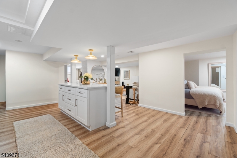 33 Mapes Avenue, Unit 2 Newark, NJ 07112 - Photo 17 of 40 a room with a bed and a view of kitchen