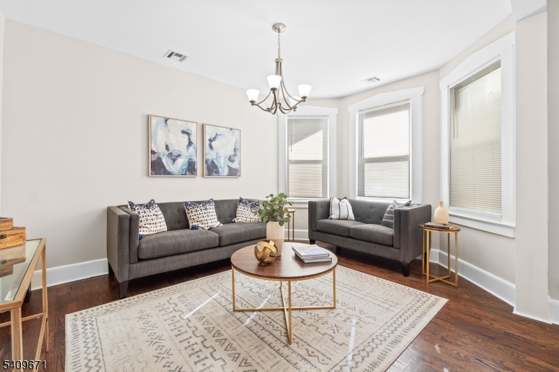 33 Mapes Avenue, Unit 2 Newark, NJ 07112 - Photo 27 of 40 a living room with furniture potted plant and a window