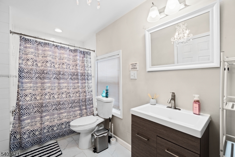33 Mapes Avenue, Unit 2 Newark, NJ 07112 - Photo 34 of 40 a bathroom with a sink toilet and shower
