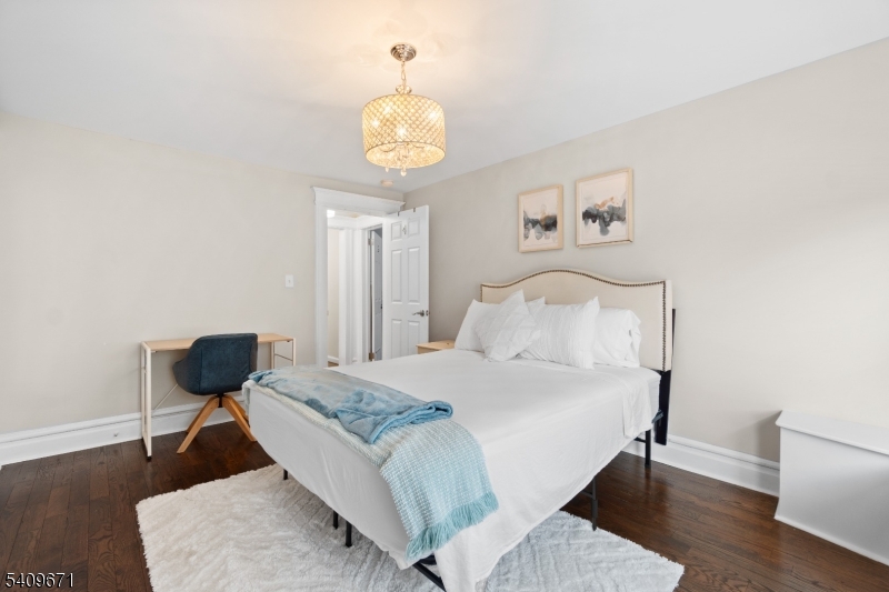 33 Mapes Avenue, Unit 2 Newark, NJ 07112 - Photo 38 of 40 a bedroom with a bed and a table