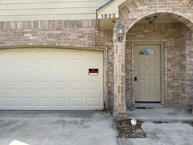 a view of a kitchen with furniture and an empty room