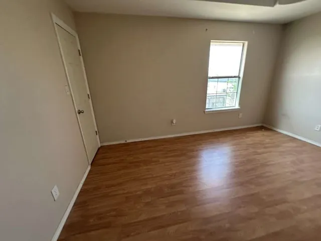 a white toilet sitting next to a bathroom sink and tub