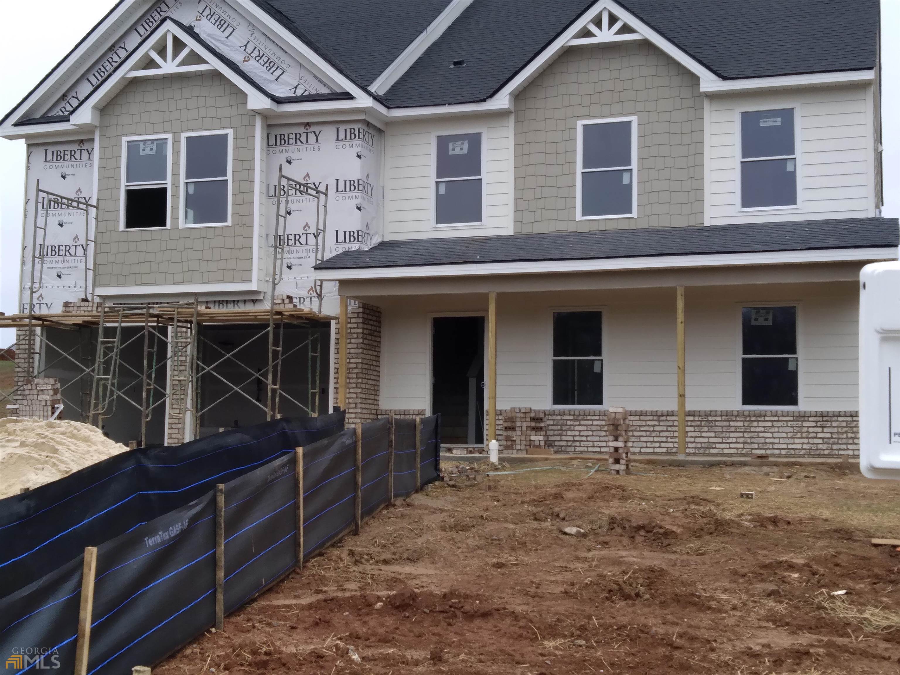 613 Overlook Road, Unit E18 Covington, GA 30014 - Photo 1 of 1 front view of a house with a yard
