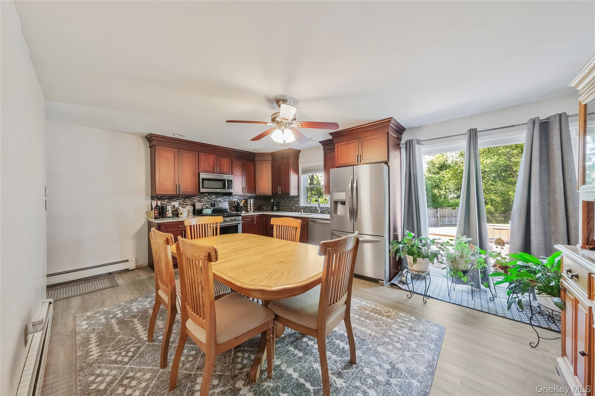 59 Maybrook Road North Babylon, NY 11703 - Photo 28 of 43 a dining room with furniture and a large window