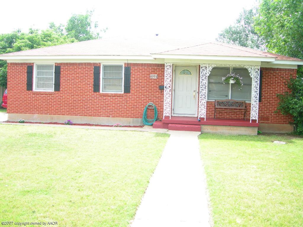 4004 Bowie Street Amarillo, TX 79110 - Photo 1 of 9 a front view of a house with a yard