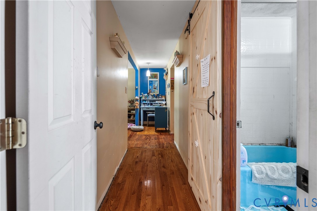 6243 Studley Road Mechanicsville, VA 23116 - Photo 35 of 65 a view of a hallway with wooden floor and staircase