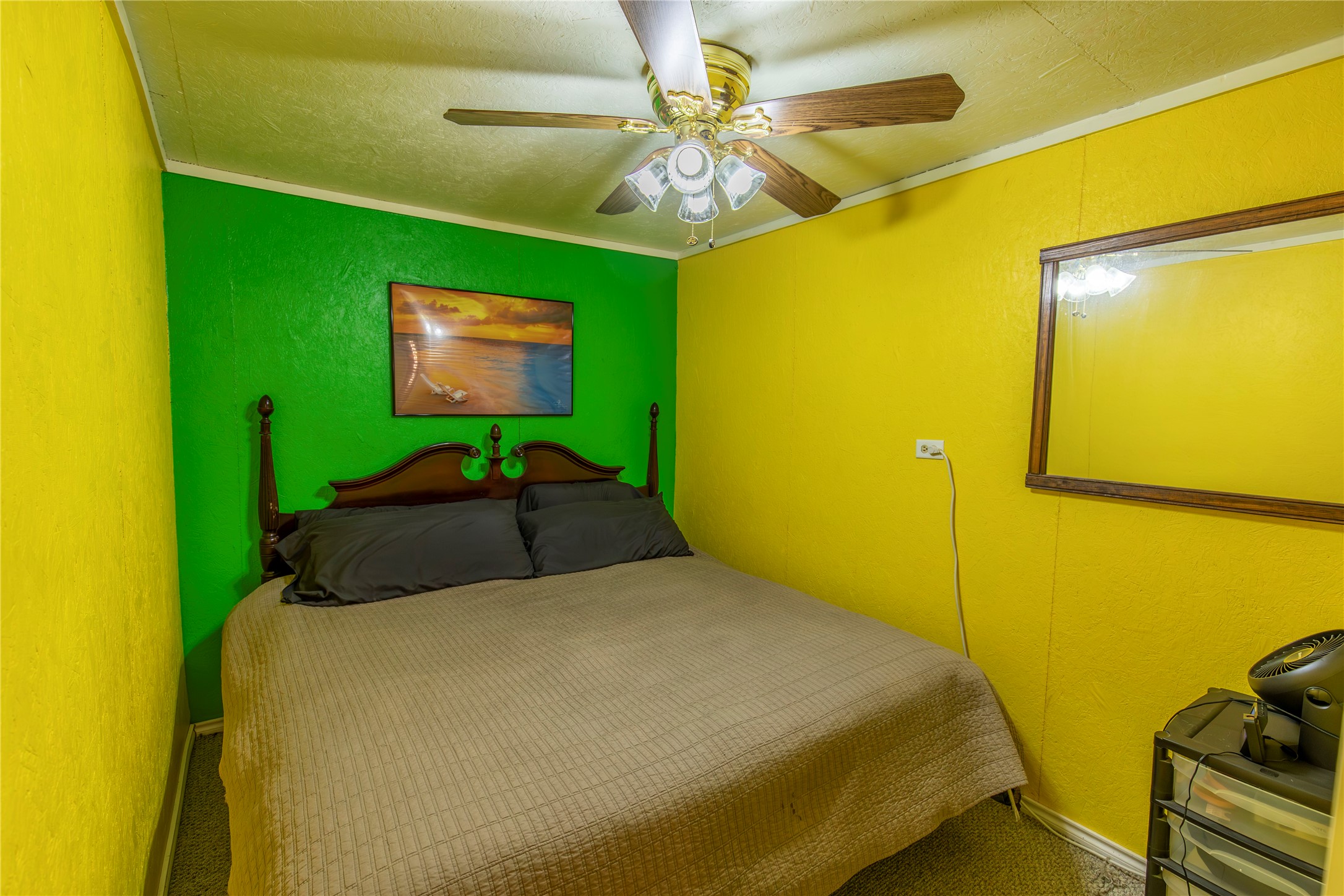 267 South Gulf Road Bay City, TX 77414 - Photo 13 of 26 a bedroom with a bed and ceiling fan
