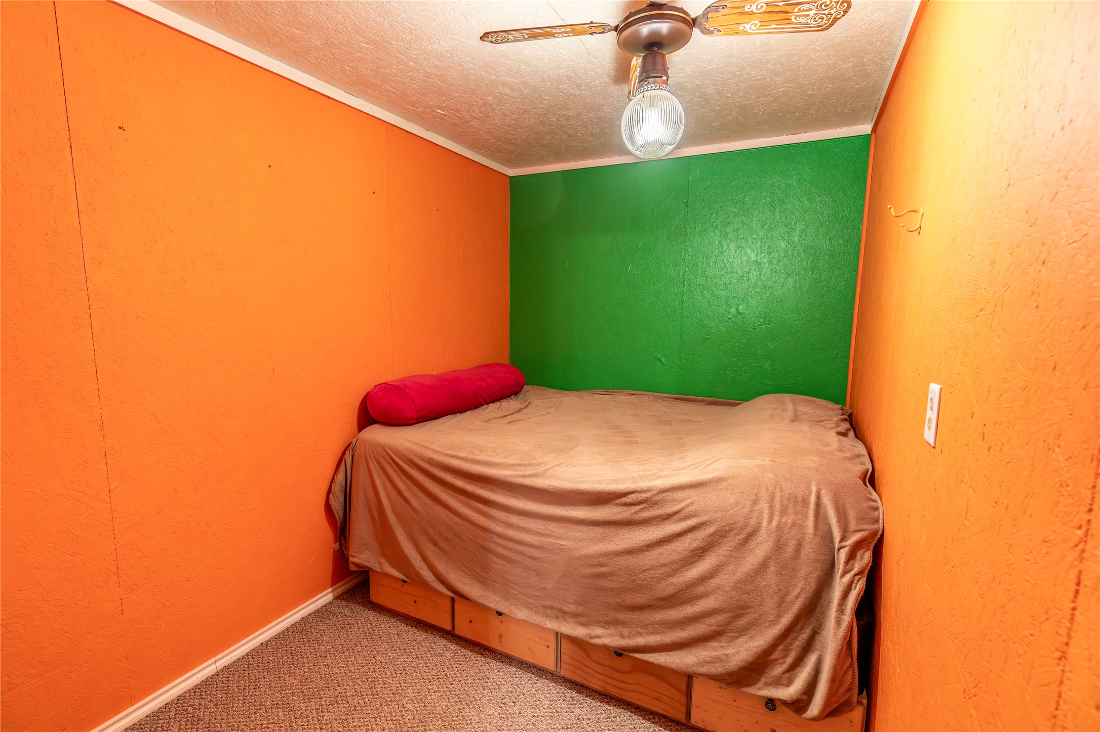 267 South Gulf Road Bay City, TX 77414 - Photo 14 of 26 a bed sitting in a bedroom next to a window