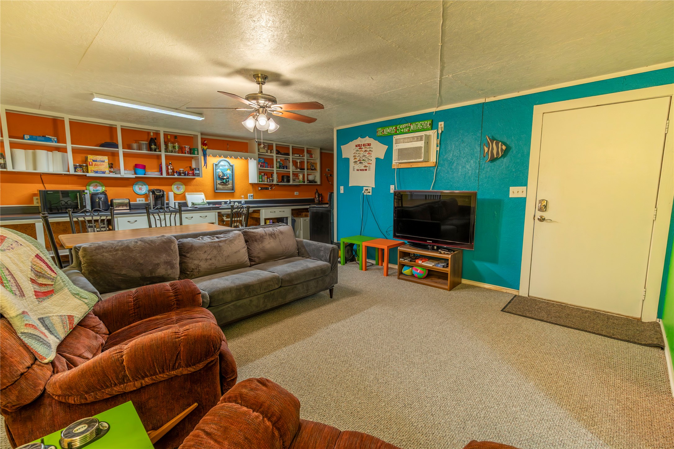 267 South Gulf Road Bay City, TX 77414 - Photo 5 of 26 a living room with furniture and a flat screen tv
