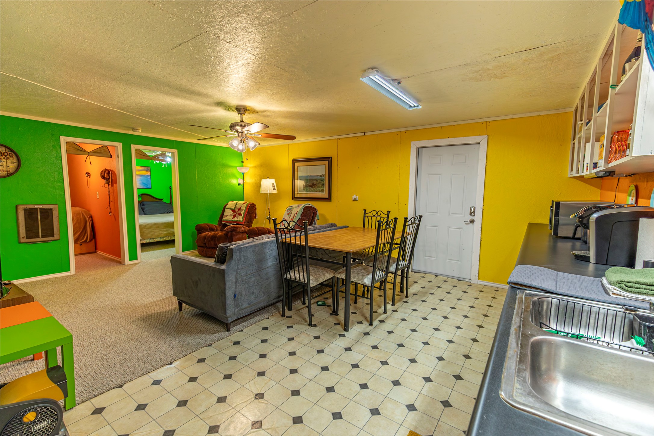 267 South Gulf Road Bay City, TX 77414 - Photo 7 of 26 a living room with furniture a flat screen tv and a dining table