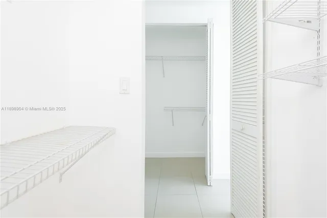 a view of a bedroom with a white door