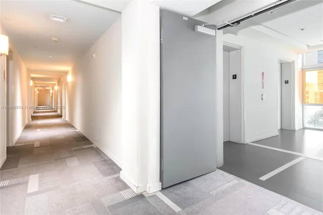 a view of a hallway with a white walls