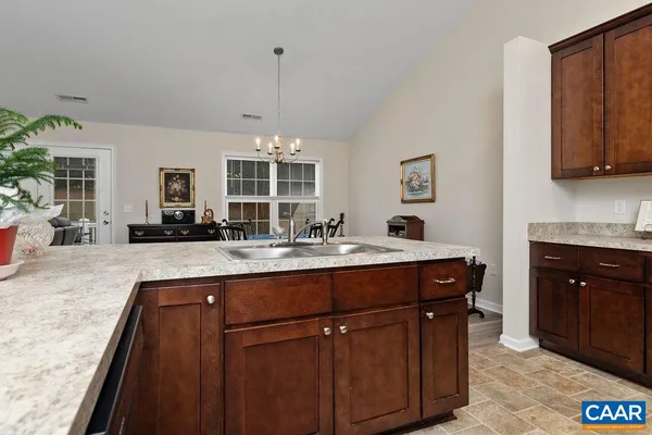 a kitchen with a sink and cabinets