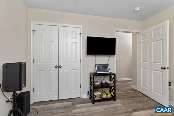 a view of a livingroom with furniture and a flat screen tv