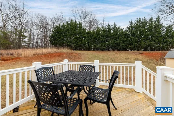 a view of balcony with furniture and trees