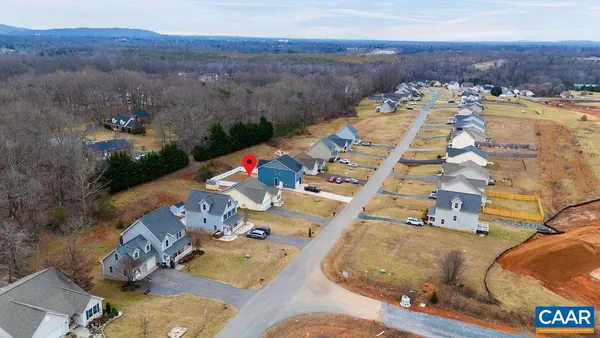an aerial view of a house with a ocean view
