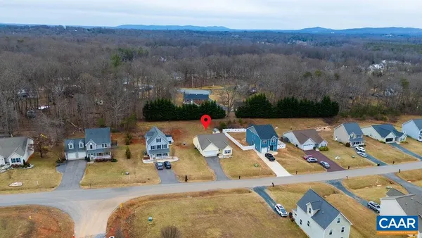 an aerial view of a house with swimming pool