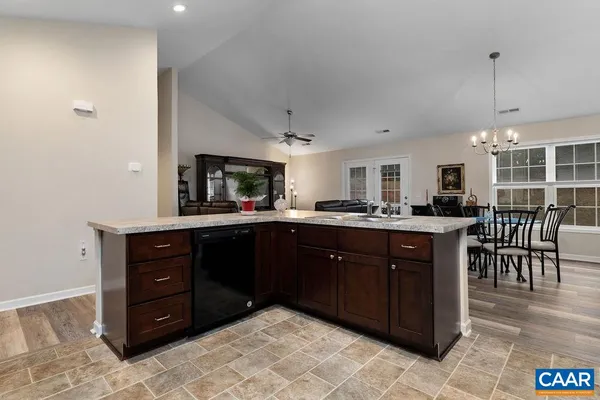 a kitchen with a wooden cabinets and center island