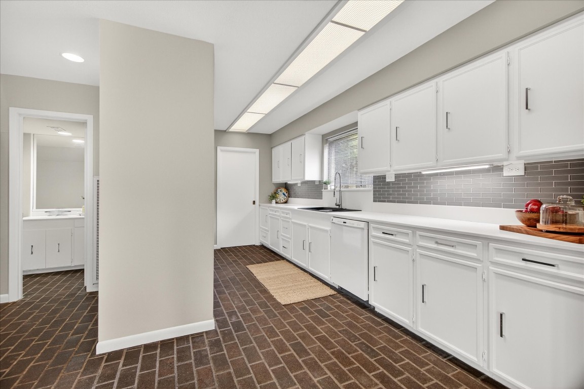 147 Valley Drive Liberty, TX 77575 - Photo 18 of 42 This efficient galley kitchen boasts abundant cabinet space.